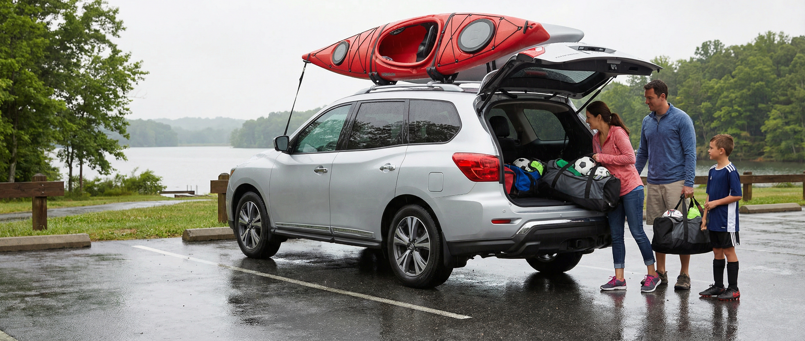 Used Nissan Pathfinder with AWD handling rainy roads in Finksburg.