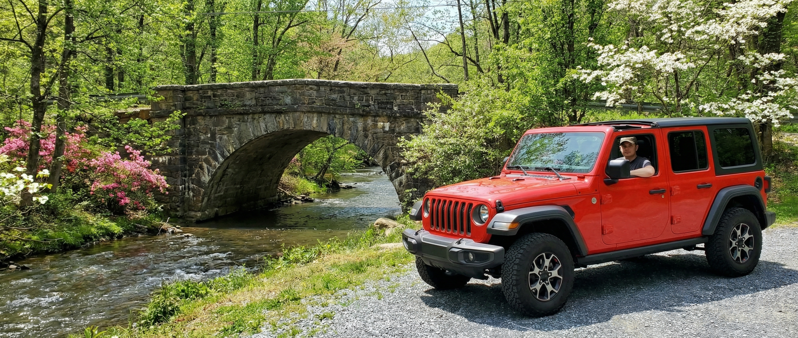 Used Jeep Wrangler JL with top down near Hampstead Maryland hills.