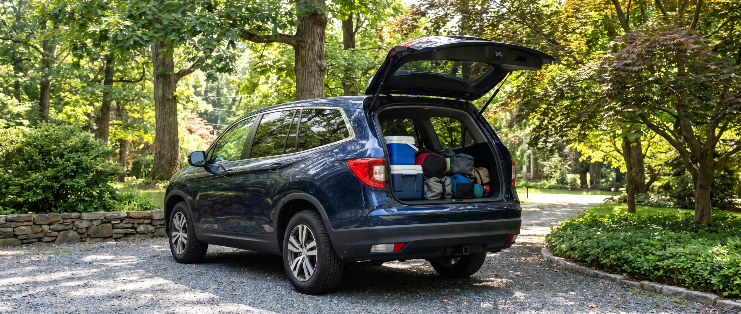 Used Honda Pilot cargo area loaded with family reunion gear in Reisterstown